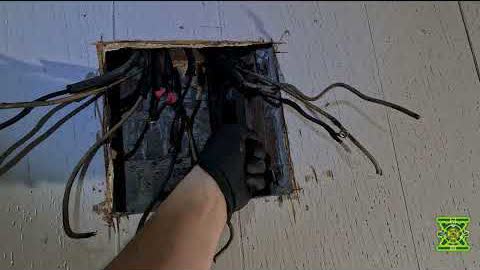 An old ceiling box opened up, packed with cloth covered wiring